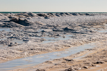 The ice volcanoes create a unique landscape along the beach edge of Lake Michigan at Harrington Beach State Park, Belgium, Wisconsin in early January