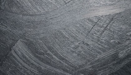 Abstract gray textured background.  Brushstrokes create dynamic pattern.
