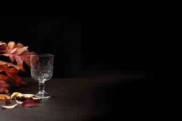 Transparent empty glass goblet on dark background