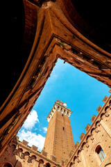 Courtyard of Palazzo Pubblico (town hall) with the Torre del Mangia in Siena historic center, Tuscany, Italy