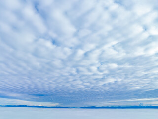 A layer of clear sky is found between high clouds and thick fog in the Pacific Northwest. The...