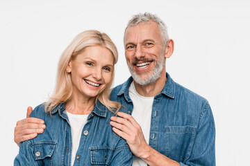 Cheerful smiling pretty couple two friends elderly gray-haired man blonde woman in denim shirt...