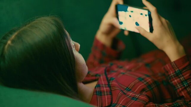 Teenage Girl Staying Up Late Playing Video Games Instead of Getting Restful Sleep