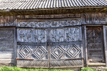 Romania, Transylvania, Carpathian Mountains. Wood wall of barn.
