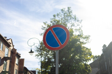 Traffic sign indicating prohibition of parking. A circle with red circumference and diameter that...