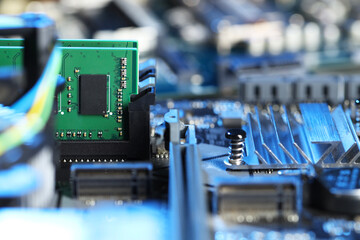 Computer motherboard with RAM chip as background, closeup. Electronic engineering