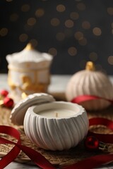 Soy wax candles on table, closeup. Beautiful Christmas decor