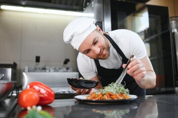 Smiling chef in his kitchen