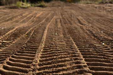 photo, print, construction, track, ground, texture, dirt, surface, land, patterned, environment, nature, photograph, outdoor, heavy, vehicle, equipment, scene, field, image