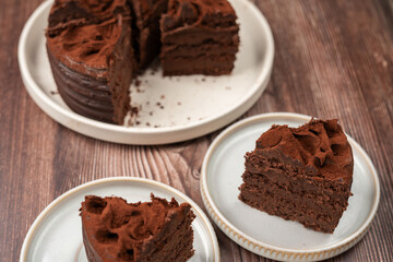 Deliciously Rich Chocolate Cake Slices on Plates: A Delectable Dessert Perfect for Celebrations, Birthdays, Special Occasions, or When You Crave a Sweet Indulgence