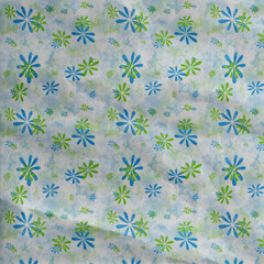 Bright blue and green floral pattern on a watercolor sky background with playful shapes and soft texture. Ideal for spring designs and children’s crafts.