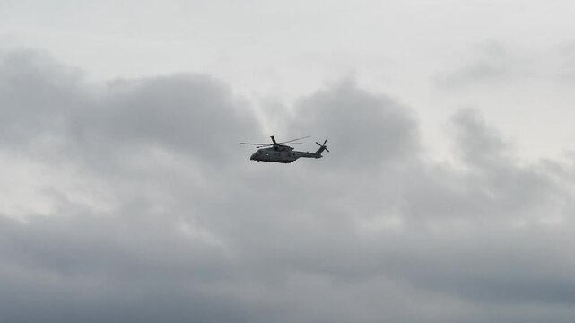 British Royal Navy Agusta-Westland Merlin HM.2 AW101 helicopter in flight on a military exercise over Wiltshire UK
