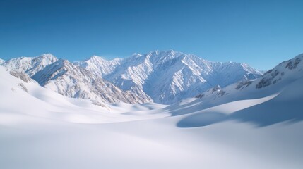 Fototapeta premium A wide-angle view of vast, white snowy mountains under a clear blue sky, showcasing a serene winter landscape.