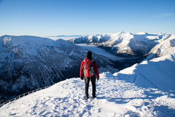 man hiking in winter Tatra mountains  Poland