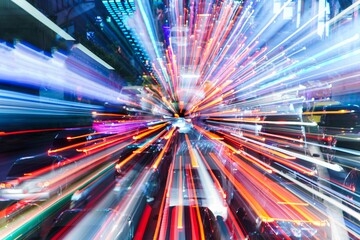 Chaos of rush hour traffic leading to intense gridlock in a bustling urban environment at night