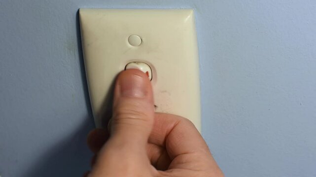 240 volt power point outlet man&rsquo;s hand unplugging lead cord repeatedly switching switch off and on and off Obsessive Compulsive Disorder OCD vertical video