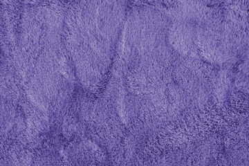 Soft shaggy purple carpet texture. Fluffy synthetic textile fur, plush textile, blanket cloth background. Wallpaper, backdrop, solid color