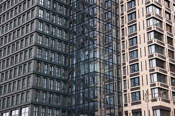 Fototapeta premium Exterior of modern building with many windows in city