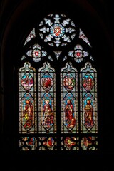 This is a beautiful stained glass window found in a church. The window depicts various biblical scenes, and it is a great example of the craftsmanship of the time.