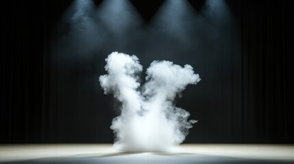 A dramatic stage with smoke effects illuminated by spotlights, creating a mysterious and atmospheric ambiance.