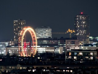 Vienna's Ferris Wheel and City Lights at Night