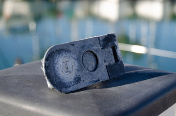 The old boat leverlock is damaged by the aggressive marine environment