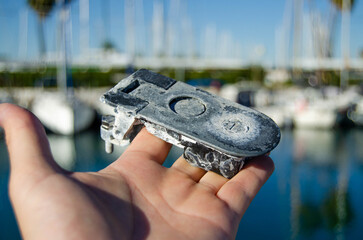 The old boat leverlock is damaged by the aggressive marine environment
