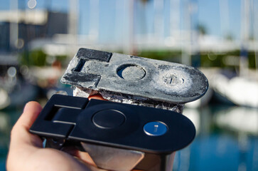 Two locks for the sailing yacht's lockers. One is old, and one is new as a replacement