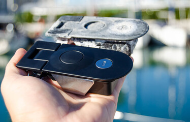 Two locks for the sailing yacht's lockers. One is old, and one is new as a replacement