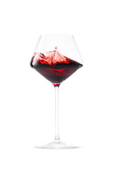 Red wine splashing in glass on white background