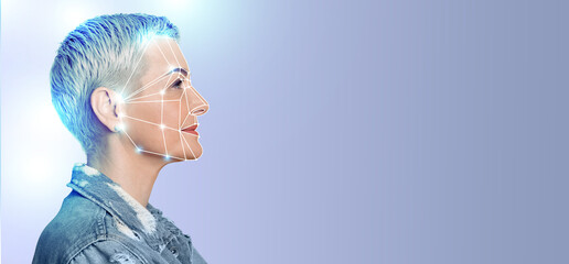 A woman is highlighted against a plain background, demonstrating facial recognition technology. The...