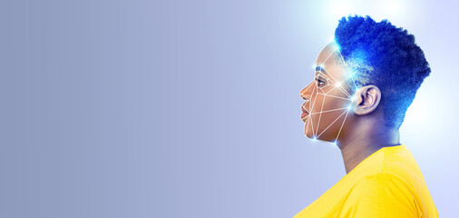 A profile view of a person with a digital overlay illustrating face recognition technology. Features bright colors that emphasize modern, advanced identification processes in an empty background.