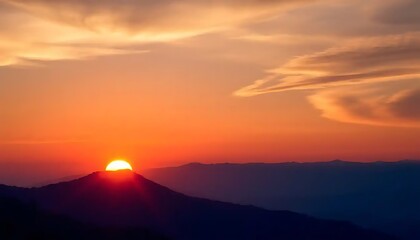 Vibrant Sunset Over Silhouetted Mountain Range