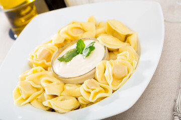 Boiled ravioli with mayonnaise. High quality photo