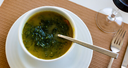 Portion of fresh caldo verde, traditional dish of Portuguese cuisine.