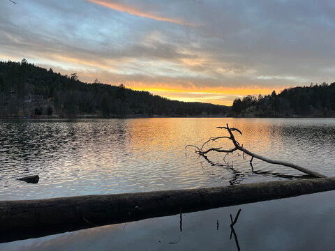 sunset shadows over the lake with clouds