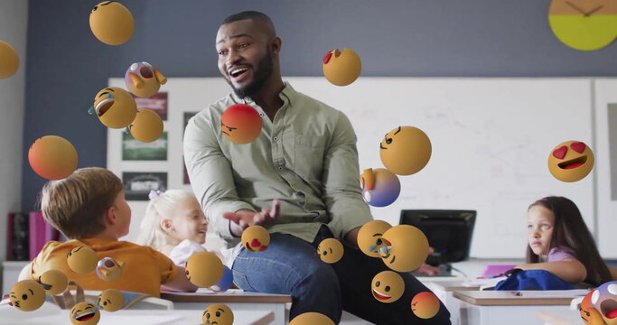 Image of emoji icons over diverse schoolchildren and teacher - Powered by Adobe