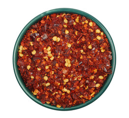 Close up spicy chili red pepper flakes, chopped, milled dry paprika pile in bowl isolated on white, top view
