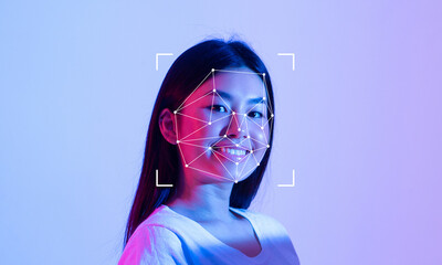 A young person is smiling while facial recognition technology is illustrated on their face.