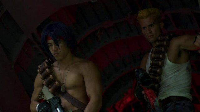 Soldier watching another guy jump out of the back of helicopter - medium shot