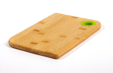 Bamboo cutting board, base for cutting food ingredients and kitchen spices made of bamboo with natural bamboo pattern, isolated on white background.