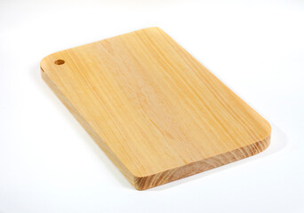 Wooden cutting board, base for cutting food ingredients and kitchen spices made of wood with natural wood pattern, isolated on white background.