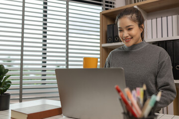 happy woman working on laptop at home office, entrepreneur using laptop at home office, mature businesswoman working from home, beautiful company owner working during isolation period