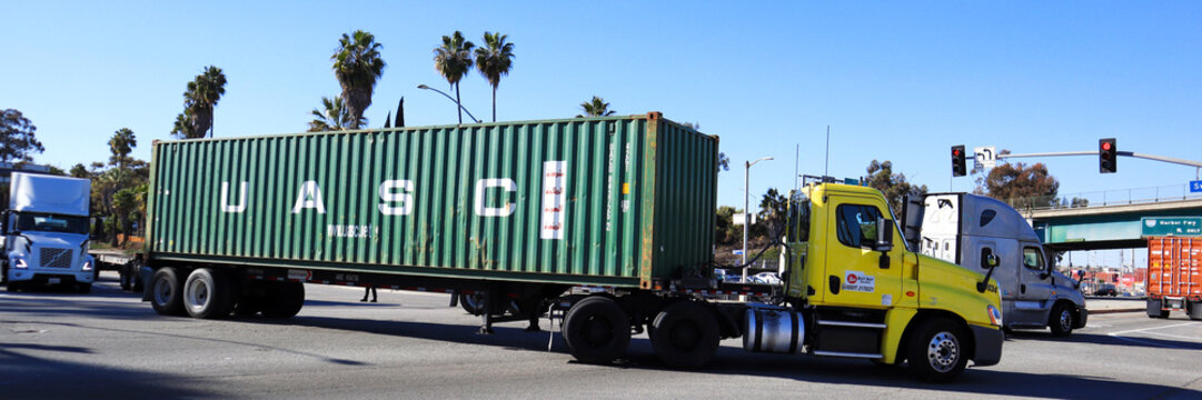 Los Angeles, California &ndash; January 13, 2025: Freight Truck carrying an UASC shipping container on a street toward the Port of Los Angeles in San Pedro