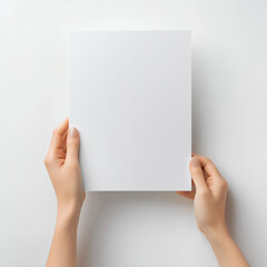 Two Hands Holding a Blank White Sheet of Paper against a Plain Background