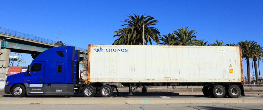 Los Angeles, California &ndash; January 13, 2025: Freight Truck carrying a CRONOS shipping container on a street toward the Port of Los Angeles in San Pedro