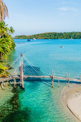 Obraz premium Tranquil shores of Koh Kood with crystal-clear waters and lush greenery