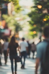 Blurred People Walking Down the Street on a Sunny Day