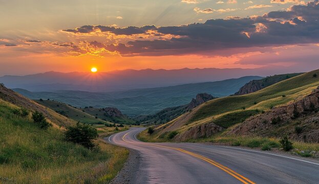 Scenic sunset over winding mountain road. - Powered by Adobe