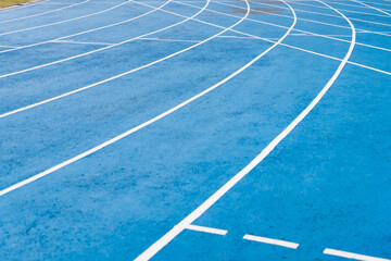 Athletics Running Track with Blue Surface and White Lane Lines Designed for Competitive Use